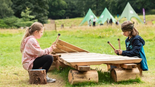 A boy and girl enjoying 'Summer of Play' activities at Gibside, Tyne & Wear